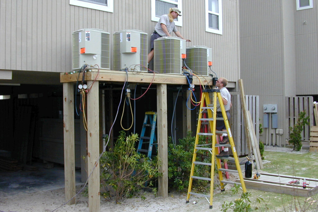 A photo of air conditioning units being elevated in Carolina Beach after Hurricane Floyd