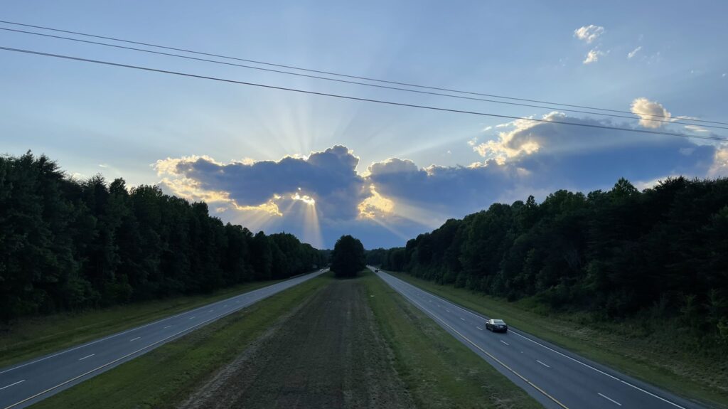 A photo of the sun behind the clouds in Surry County