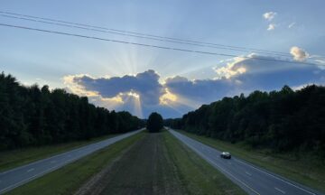 A photo of the sun behind the clouds in Surry County