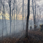A photo of fire crews working in smoky conditions at the Hurricane Ridge wildfire