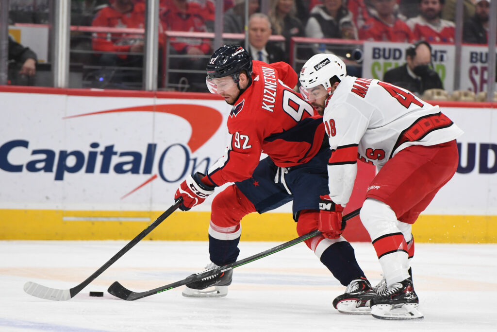 Hockey players Evgeny Kuznetsov and Jordan Martinook during the March 2022 game between Carolina and Washington