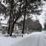 A photo of snow on the ground at the Currituck Beach Light Station on February 19