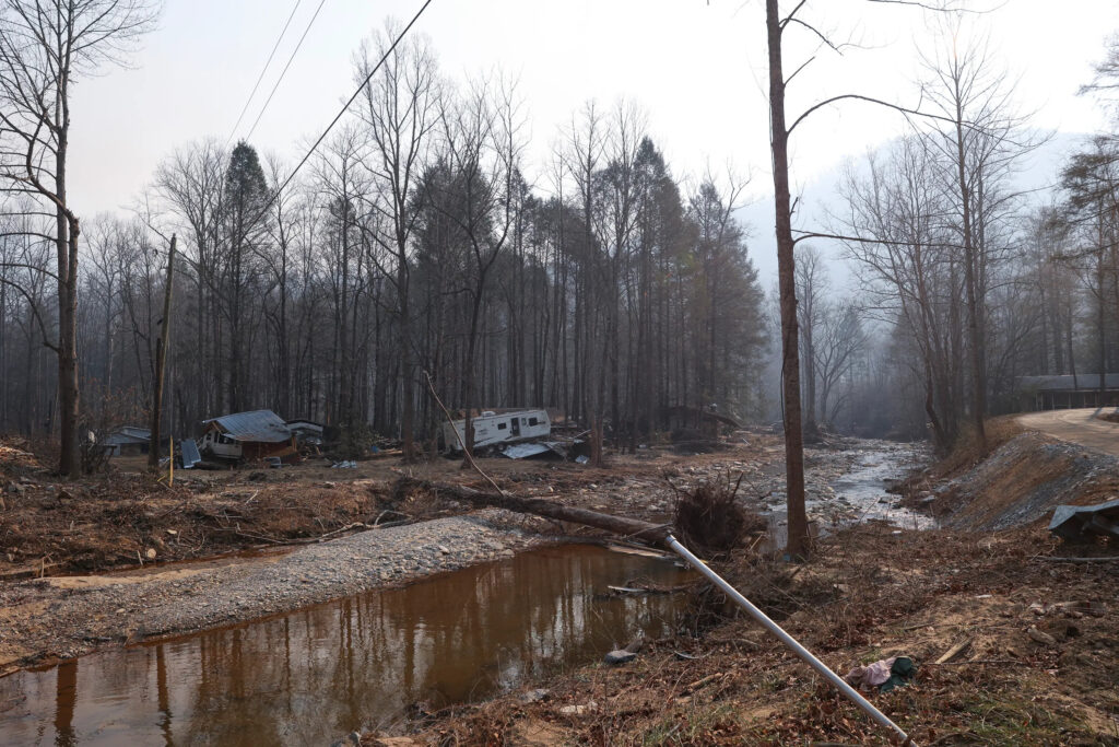 A photo of storm damage along Buck Creek while wildfire smoke filled the air last December