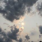 A photo of the sun in a hazy, cloudy sky over the Outer Banks on June 1