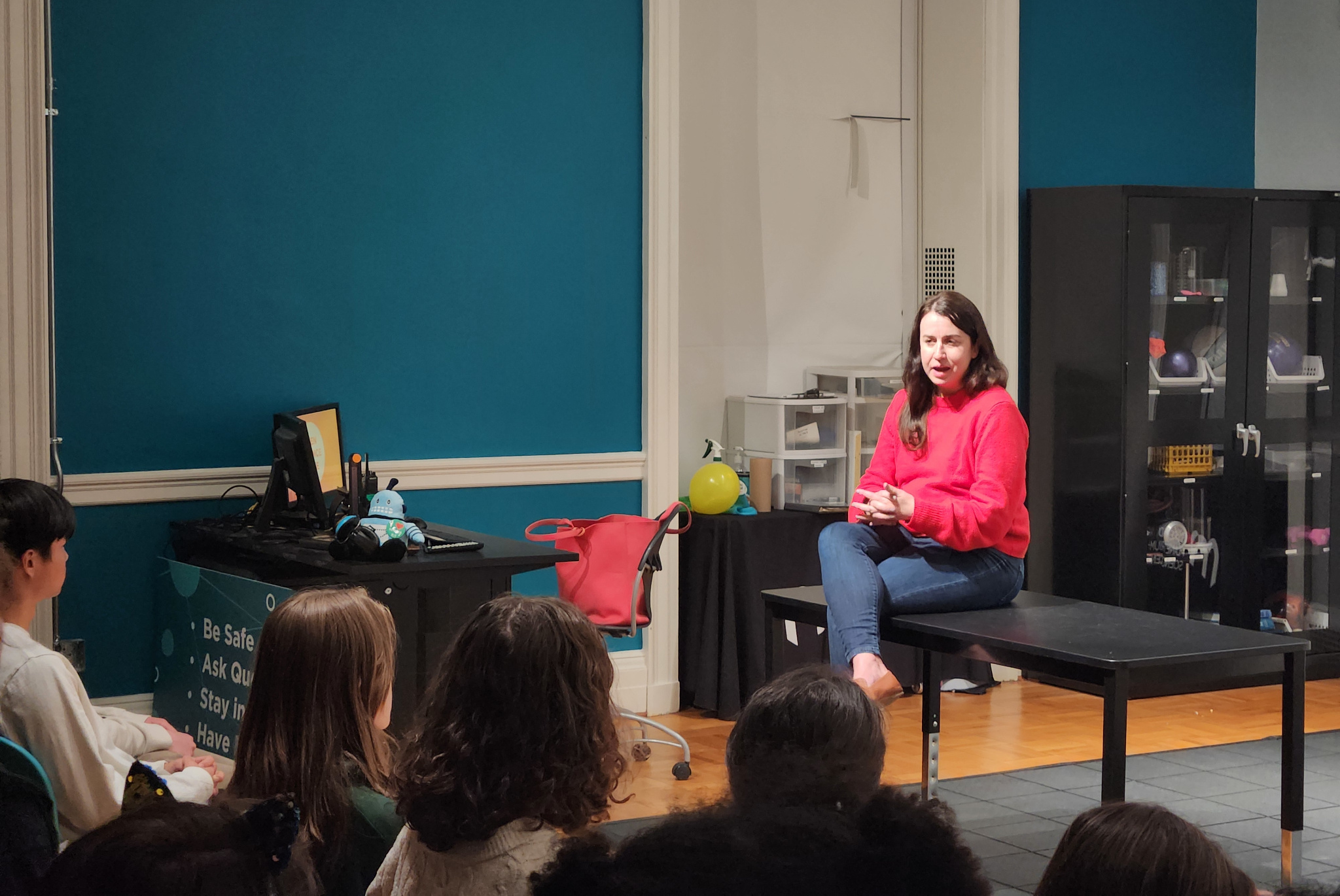 A photo of Kathie Dello speaking to students at Morehead Planetarium's Teen Science Cafe