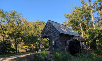 A photo of small barn in Reidsville with sunny blue skies overhead